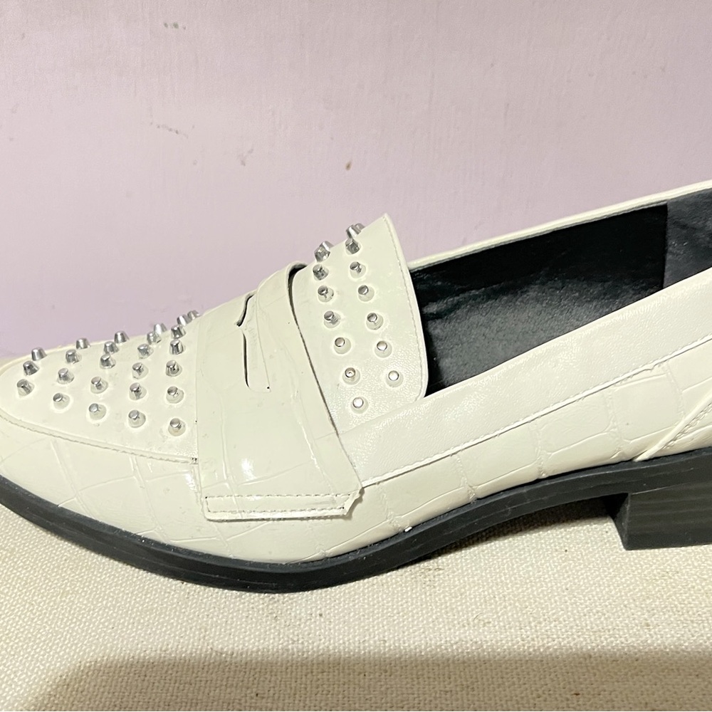 Stylish, silver-studded, white loafers size 9 with 1”heel.